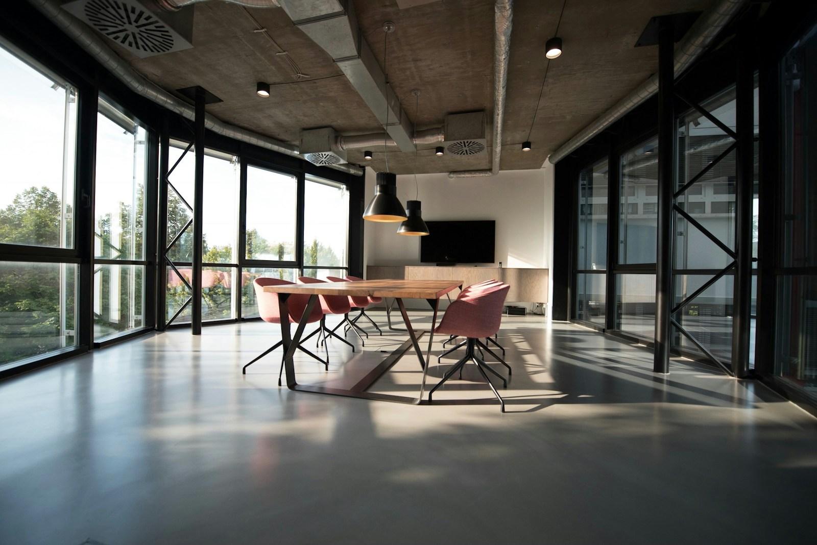 Meeting table and chairs in a bright open studio