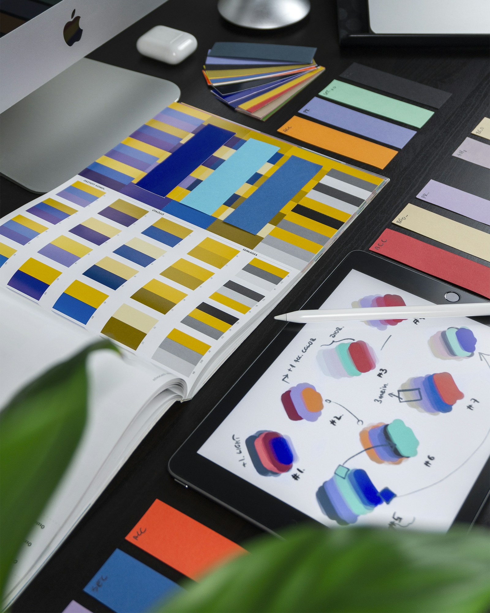 Brand identity design materials laid out on a desk