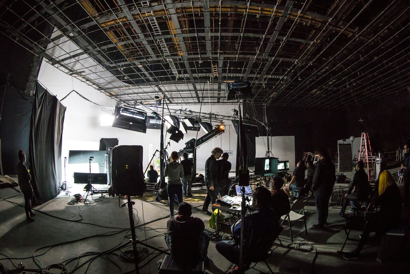 Film crew and camera equipment on a production soundstage