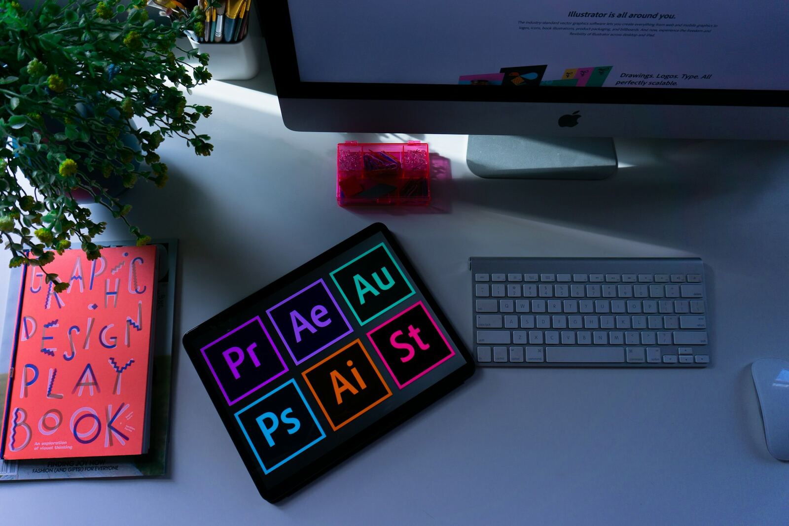 Desk with a monitor and tablet showing animation and design software